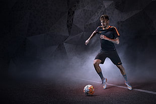 close up photograph of man about to kick soccer ball HD wallpaper