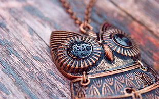 copper-colored owl pendant