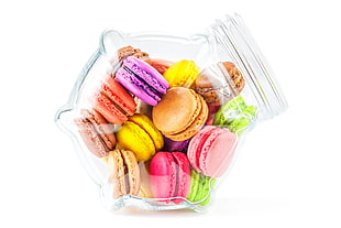assorted color macaroons on clear glass jar HD wallpaper