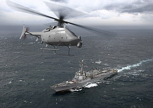 gray helicopter on the top of ship