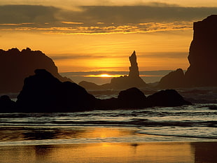 silhouette of rock formations at golden hour