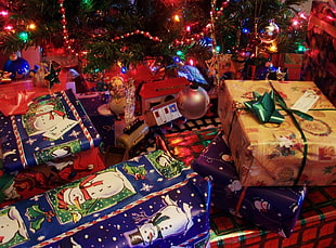 gift boxes under faux tree