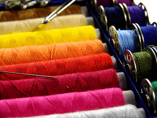 photography of sewing threads