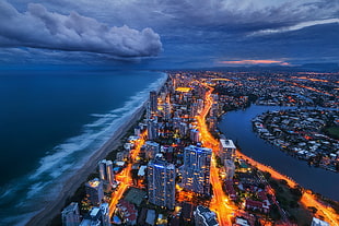 aerial photography of city scape, cityscape, skyline, sea, clouds