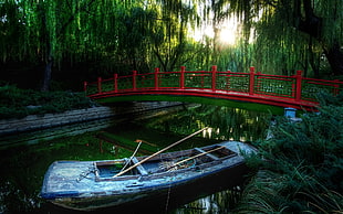 gray wooden boat on body of water near red painted bridge HD wallpaper