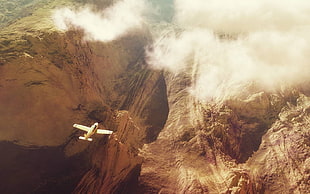 white plane, airplane, mountain pass, clouds