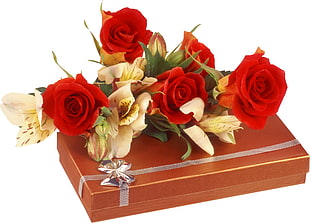 red and yellow flowers on top of red gift box