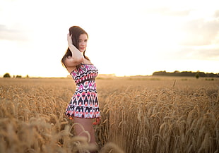 woman wearing white, pink, and black tribal print tube dress on wheat field HD wallpaper