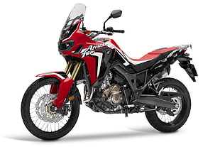 black and red Africa Twin motorcycle with white background