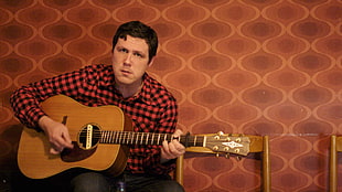 man holding brown acoustic guitar HD wallpaper