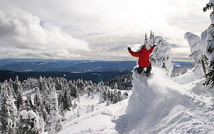 man wearing orange jacket in snowy mountain HD wallpaper