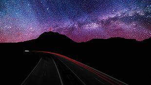 asphalt road during night time HD wallpaper