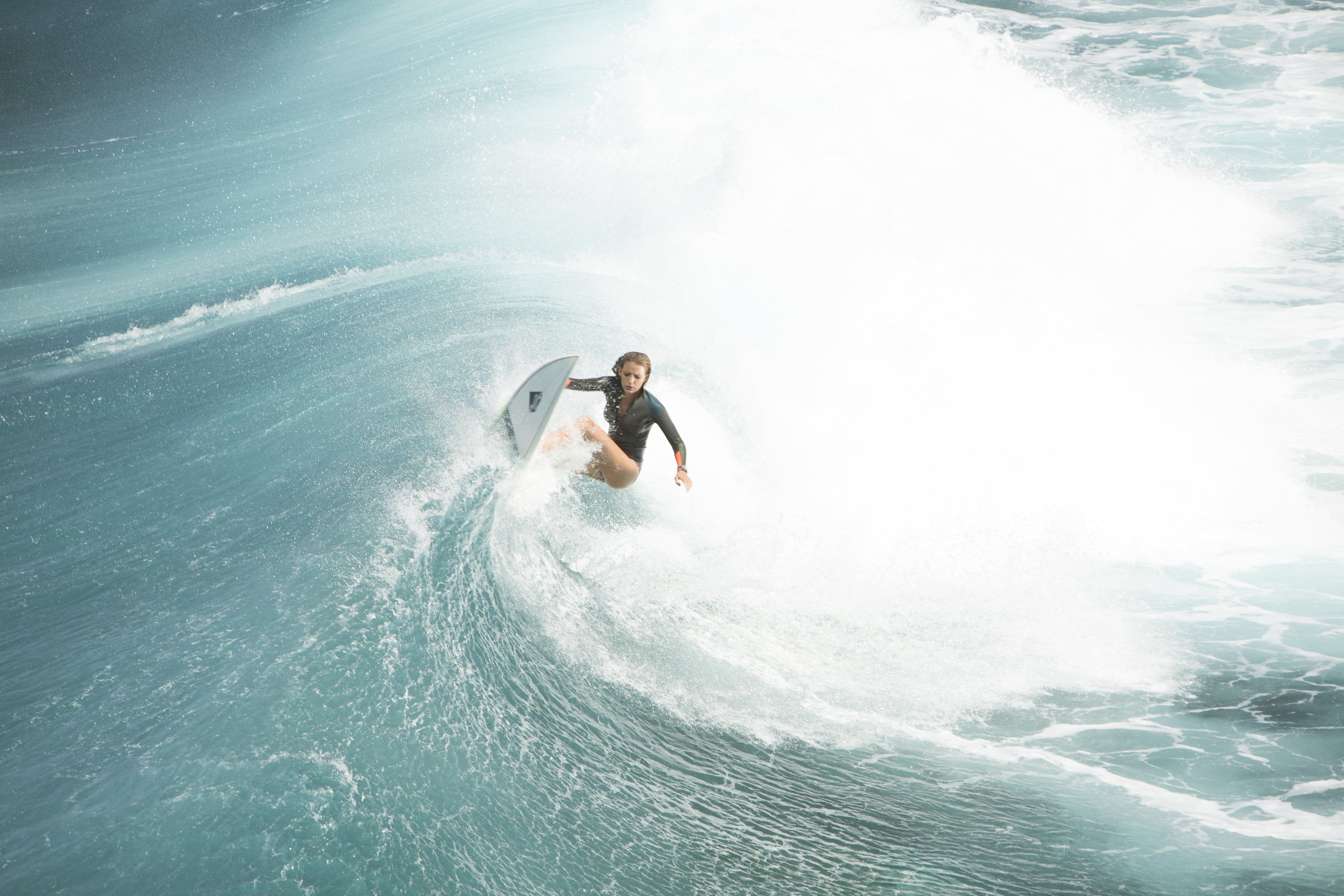 photo of woman surfing