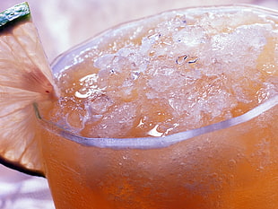 ice on orange liquid
