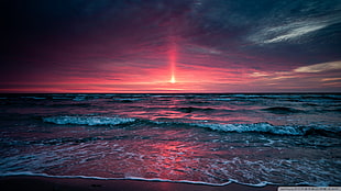 rectangular brown wooden coffee table, sunset, sea, sky