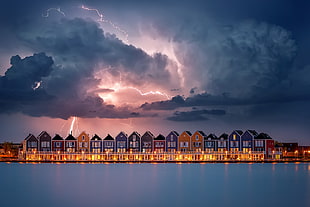 assorted-color houses with lightning from the sky panoramic photography, Michiel Buijse, sky, digital art, Netherlands