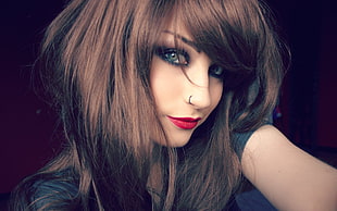 photo of woman with brown hair and piercing