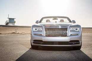 photo of silver Rolls Royce along highway
