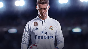 close-up photography of Cristiano Ronaldo man wearing white Adidas Fly Emirates jersey shirt