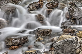 water flowing on rocks HD wallpaper