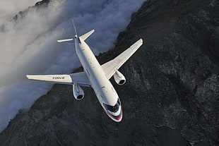 white and black airplane, airplane, mountains, Sukhoi Superjet 100, Russia HD wallpaper