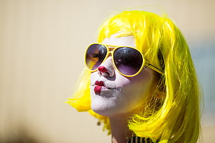 woman wearing sunglasses with yellow hair