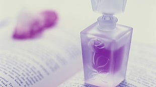shallow focus image of purple spray bottle