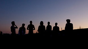 silhouette photography of seven people during daytime