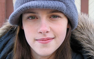 woman wearing blue hat