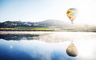 air balloon near to body of water