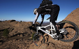 black and white full-suspension bike, cannondale, sport 