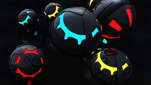 red, black, and yellow light ball toys