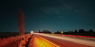asphalt road, road, starry night, night, lights HD wallpaper