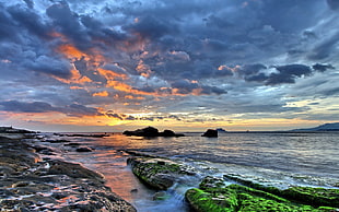 seashore and rocks, water, sunset, clouds, sea