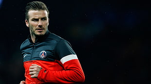 David Beckham in red and black half-zipped sweater