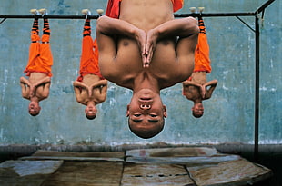 Monk hanging on steel bars