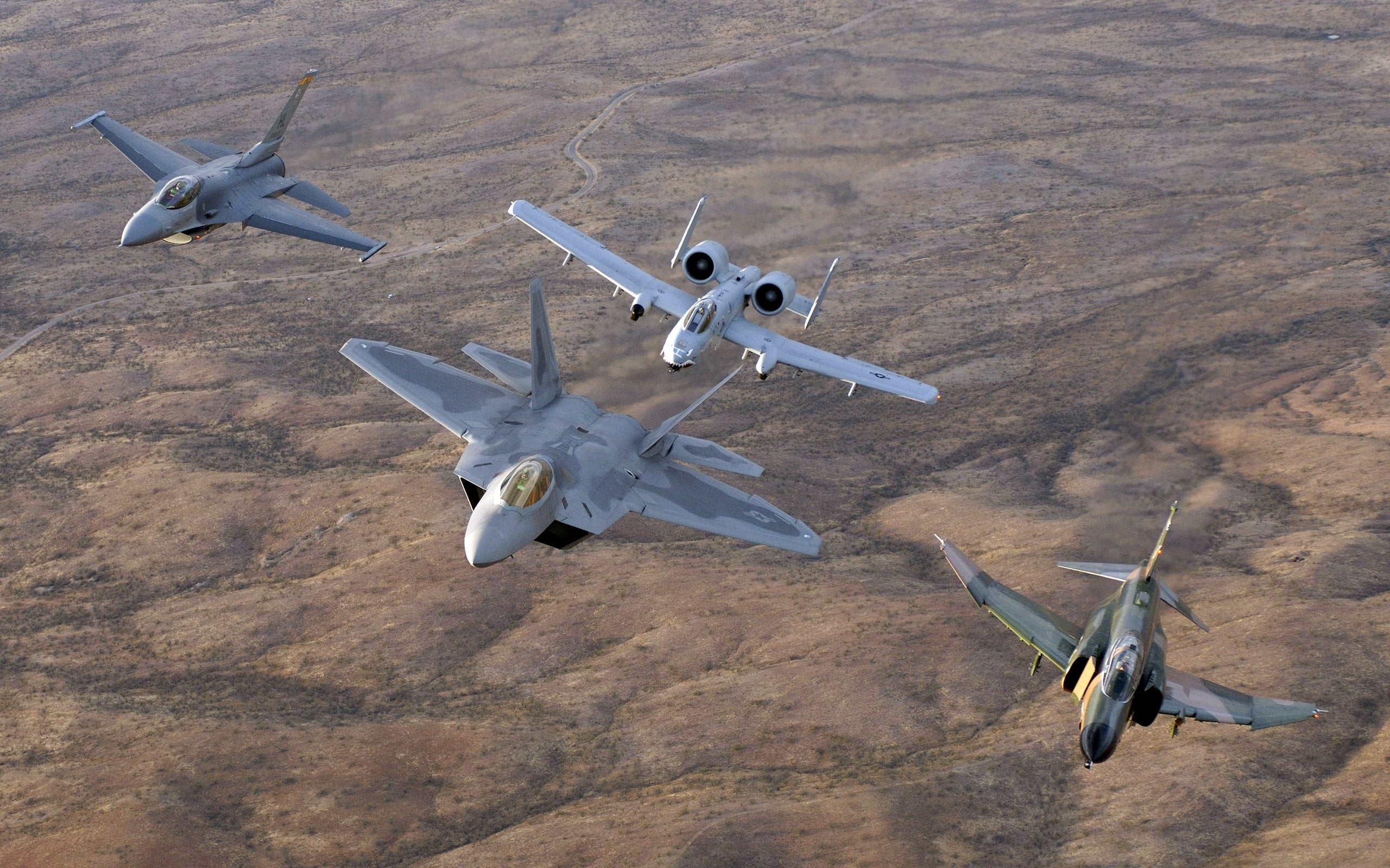 four gray fighter jets, General Dynamics F-16 Fighting Falcon, McDonnell Douglas F-4 Phantom II, Fairchild A-10 Thunderbolt II, F-22 Raptor