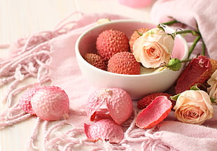 red round fruits and pink rose