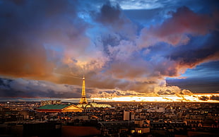 Eiffel Tower under clouded blue sky
