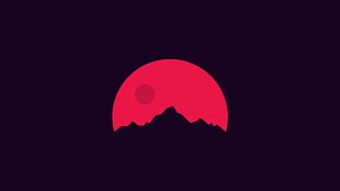 red full moon behind mountain