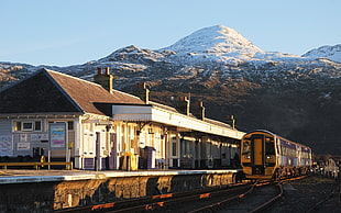 black and brown train, train station, train, mountains, snowy peak