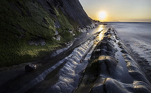 gray rock cliff, coast, sunlight, sea, nature HD wallpaper