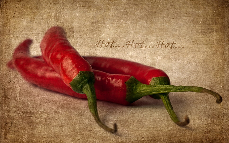 three red chili peppers on beige surface HD wallpaper
