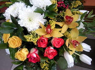 red and yellow Roses, yellow Orchids, and white Tulips bouquet