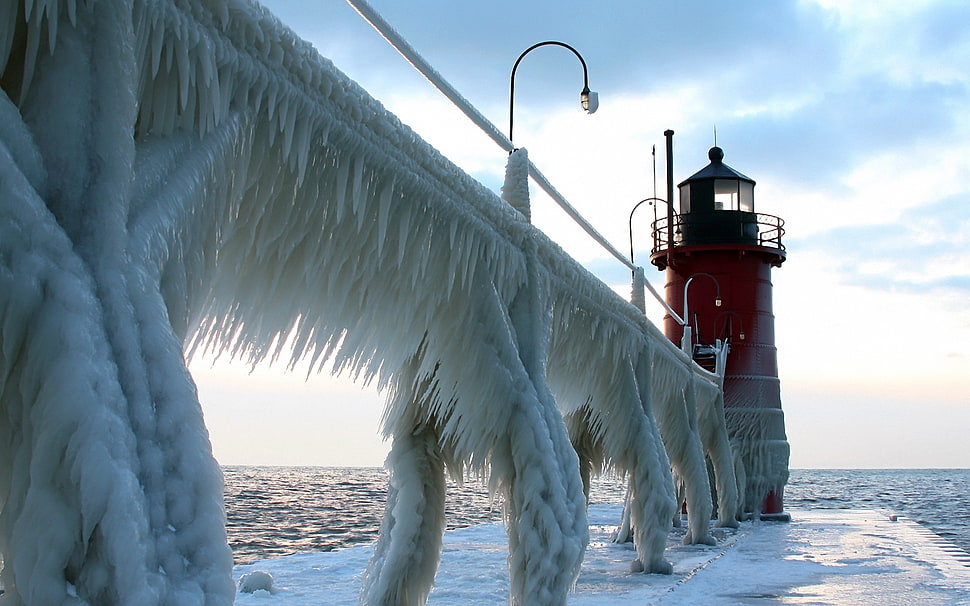 red lighthouse during daytime HD wallpaper