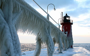 red lighthouse during daytime HD wallpaper