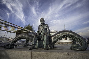 man sitting on kraken statue, Jules Verne, fantasy art, sculpture, octopus HD wallpaper