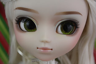 close up photo of female doll in blonde hair