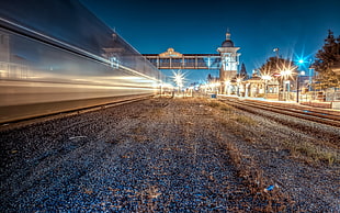 photography of train rails during nighttime