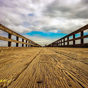 low-angle photography of wooden bridge pathway HD wallpaper